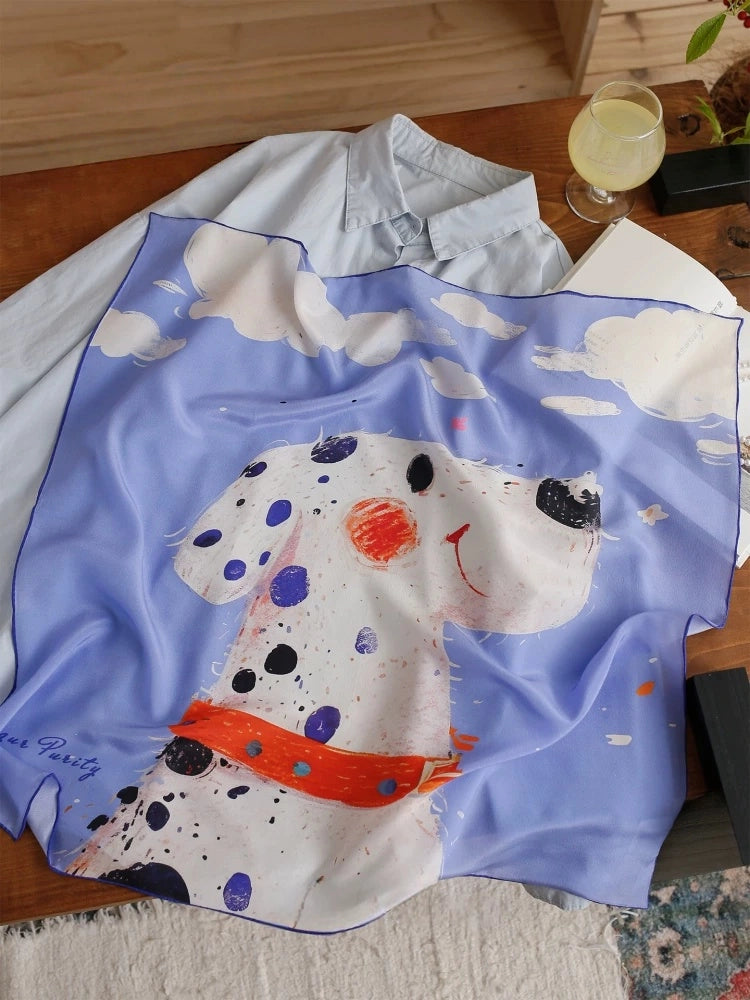 Blue dalmatian print silk square scarf laid flat showing soft mulberry silk texture and animal pattern