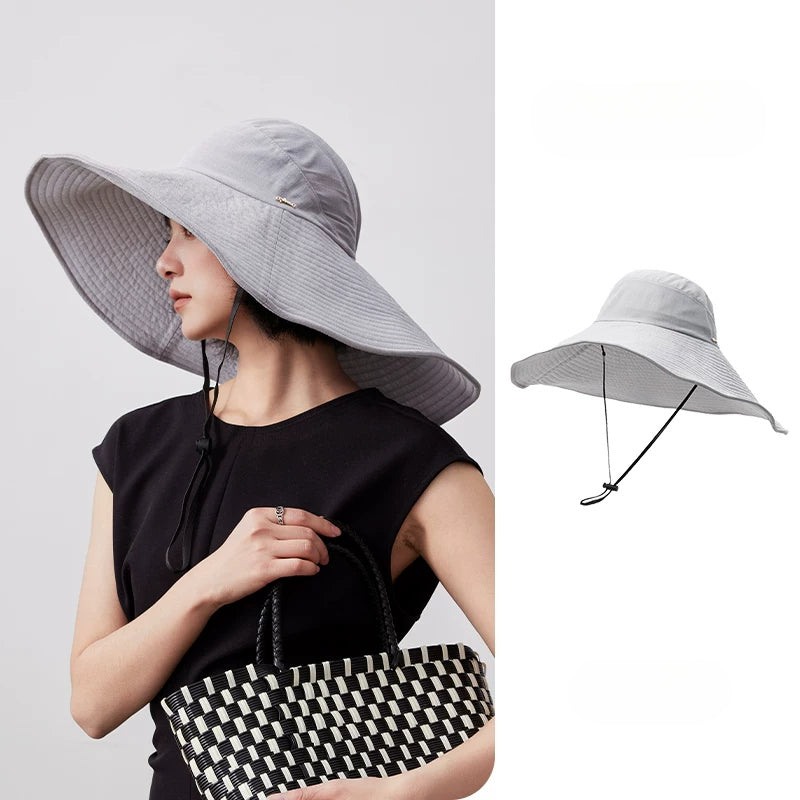 Blue gray UPF 100 wide brim foldable sun hat with adjustable chin strap and packable design