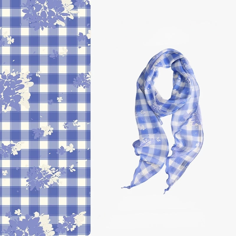 Blue and white plaid 100% mulberry silk skinny scarf with delicate floral details, shown flat and softly draped.