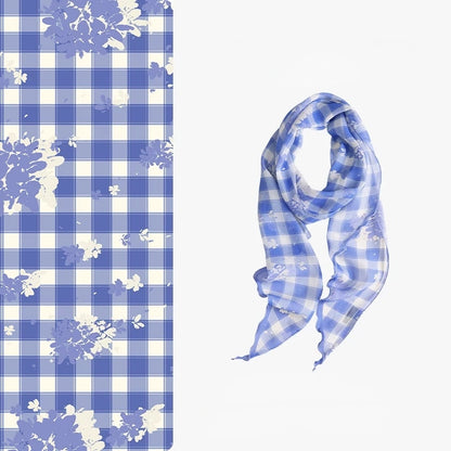 Blue and white plaid 100% mulberry silk skinny scarf with delicate floral details, shown flat and softly draped.