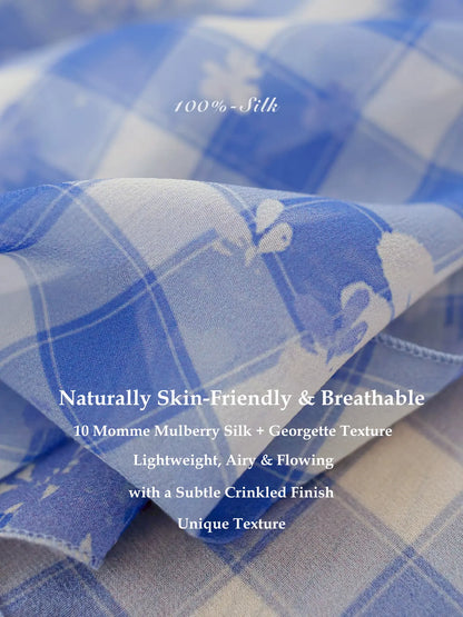 Close-up of blue white plaid 100% mulberry silk georgette scarf with breathable texture and subtle crinkled finish.