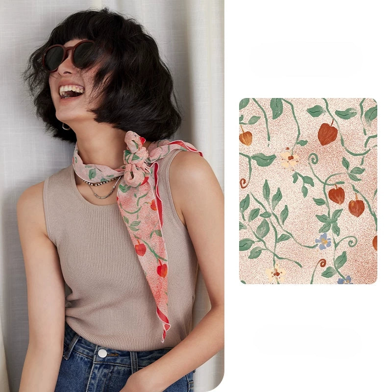 Blush pink botanical skinny silk scarf styled around the neck with matching print detail