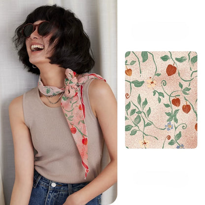 Blush pink botanical skinny silk scarf styled around the neck with matching print detail