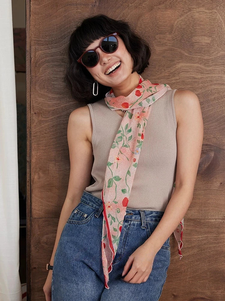 Blush pink skinny silk scarf tied as a necktie with casual denim outfit