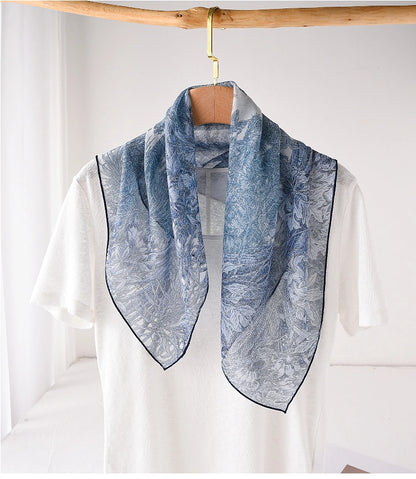 Blue mulberry silk neck scarf styled loosely over a white top for elegant daily wear