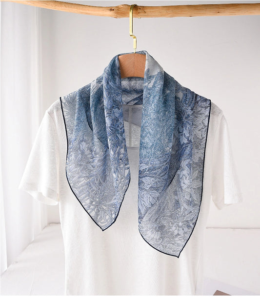 Blue mulberry silk neck scarf styled loosely over a white top for elegant daily wear