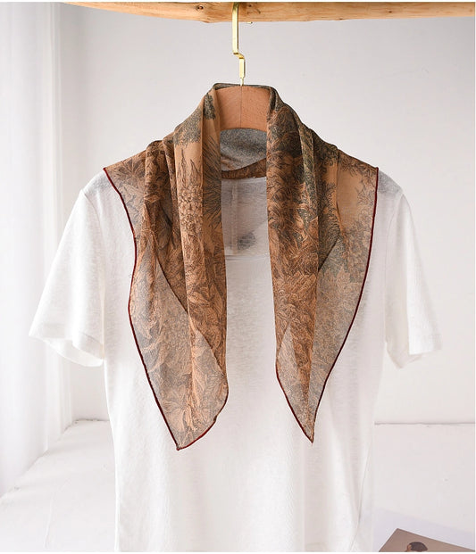 Deep coffee botanical mulberry silk neck scarf styled over a white top