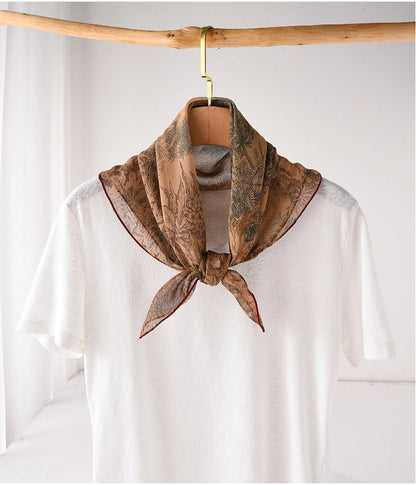 Deep coffee silk square scarf tied at the neck with vintage floral garden print