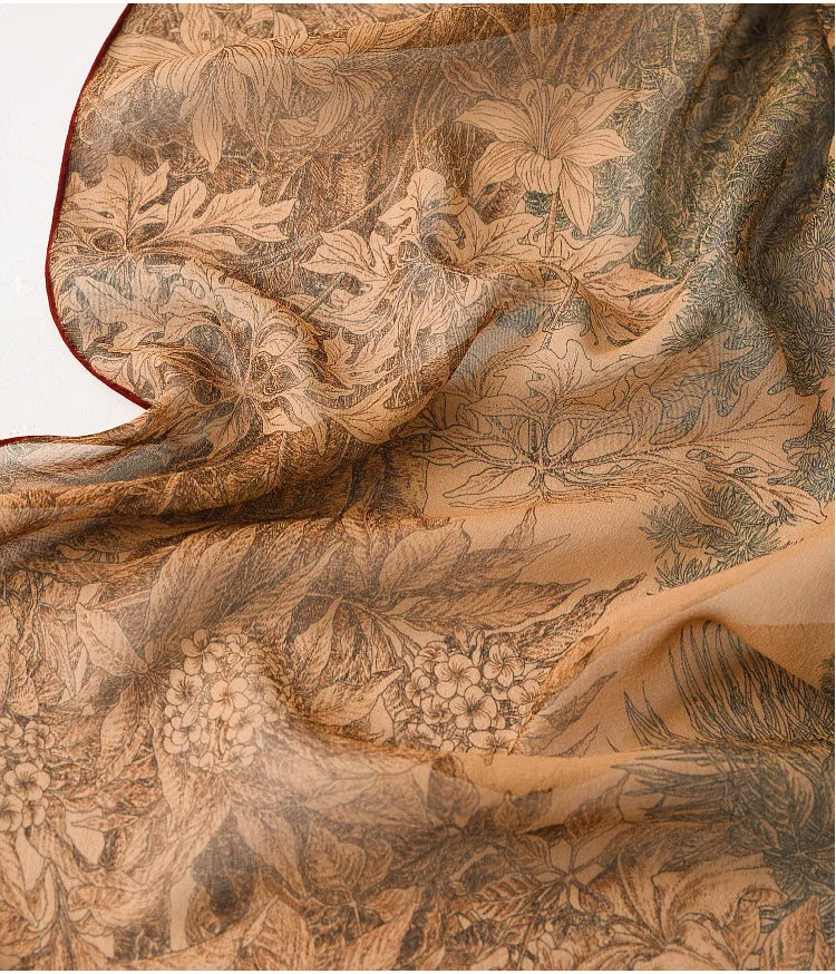 Close-up of deep coffee mulberry silk scarf showing botanical print and lightweight chiffon finish
