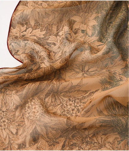 Close-up of deep coffee mulberry silk scarf showing botanical print and lightweight chiffon finish