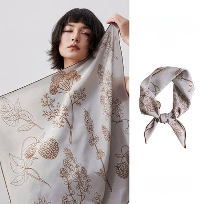 Botanical print silk square scarf in 100% mulberry silk, shown with elegant floral pattern and headscarf styling detail
