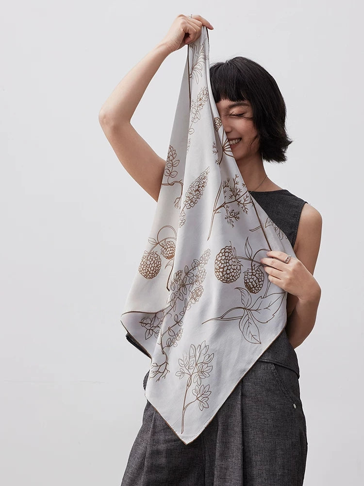 Lightweight botanical print silk scarf for women, styled as an elegant square scarf with soft drape