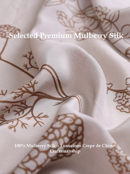 Close-up of botanical print mulberry silk scarf showing smooth silk texture, soft sheen, and delicate floral pattern
