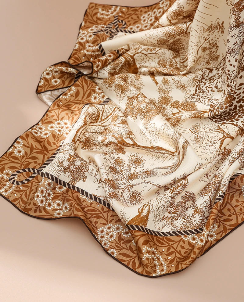 Close-up of brown cheetah forest silk square scarf with smooth mulberry silk texture and refined printed border