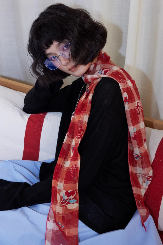 Burgundy skinny silk scarf with cherry plaid print styled as a soft neck scarf for a modern vintage look