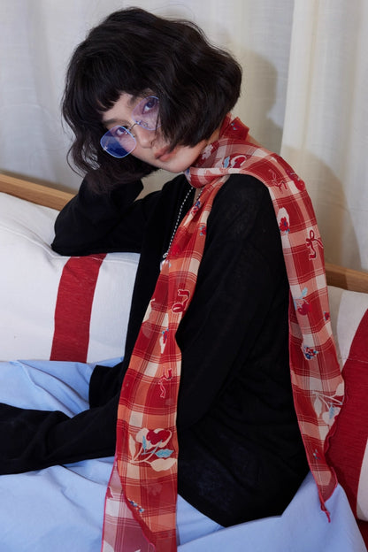 Burgundy skinny silk scarf with cherry plaid print styled as a soft neck scarf for a modern vintage look
