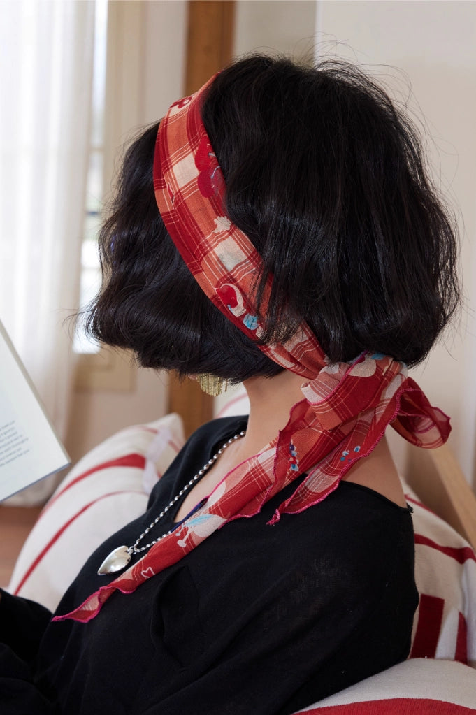 Red plaid skinny silk scarf styled as a scarf headband, ideal for hair styling and vintage-inspired outfits