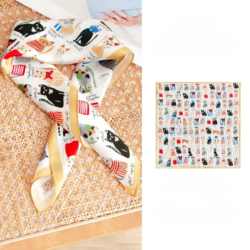 Small silk square scarf with colorful cat print, styled flat to show the full 100% mulberry silk design.