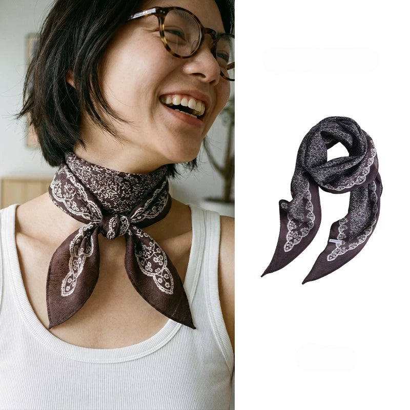 Woman wearing a coffee brown vintage floral silk wool scarf beside a full product view