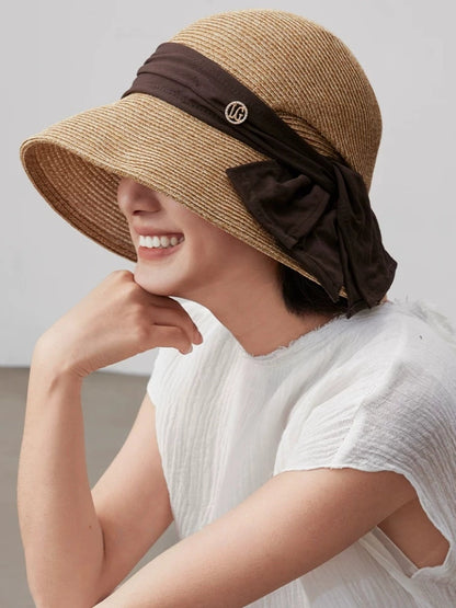 Coffee paper straw sun hat with wide brim and soft ribbon detail, styled for beach trips, vacations and daily sun protection.
