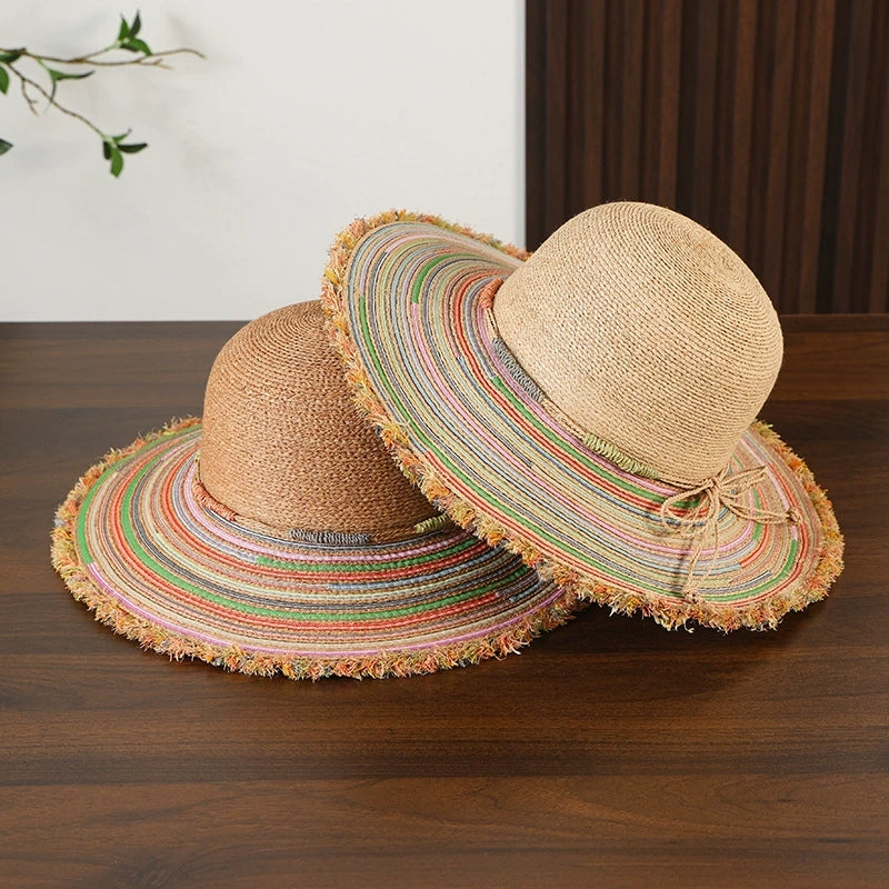 Beige and brown raffia wide brim sun hats with colorful frayed edge for summer beach style.