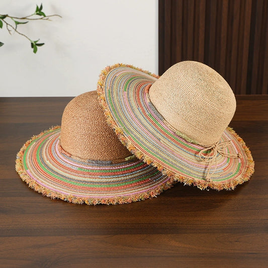 Beige and brown raffia wide brim sun hats with colorful frayed edge for summer beach style.