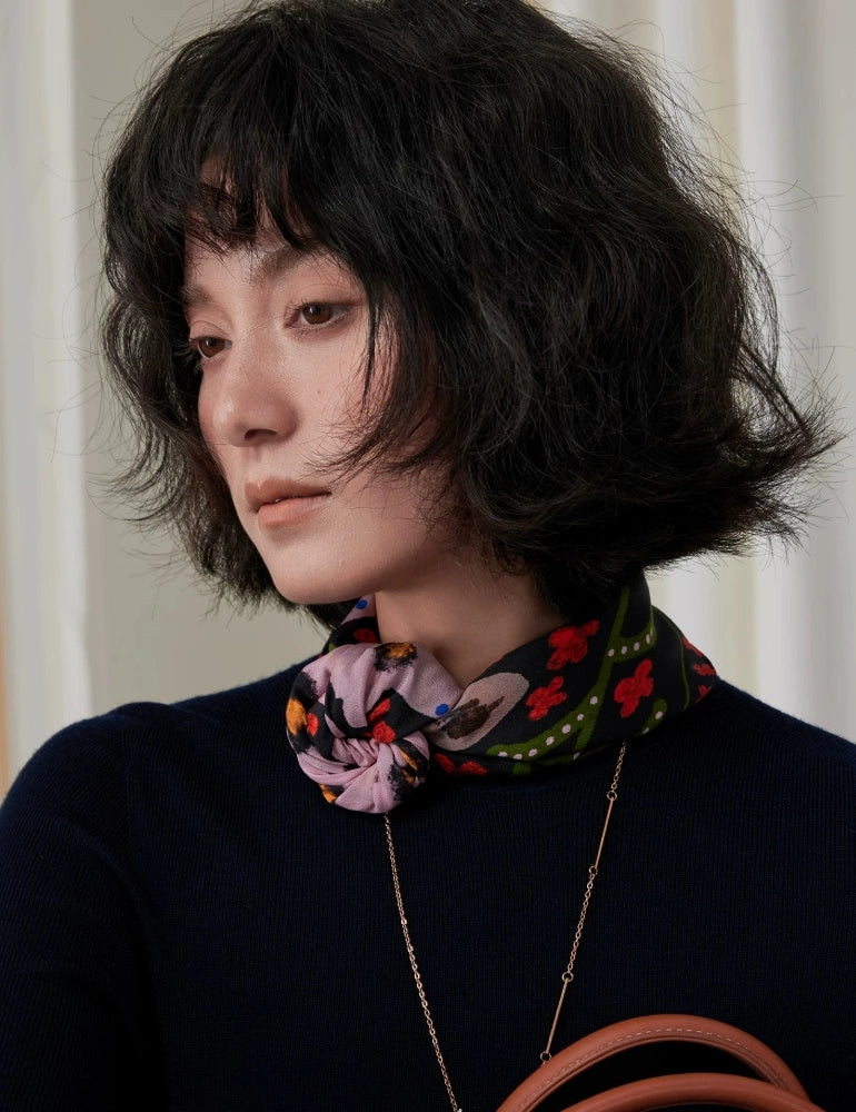 Smiling woman styling a crimson leopard floral silk square scarf around her neck