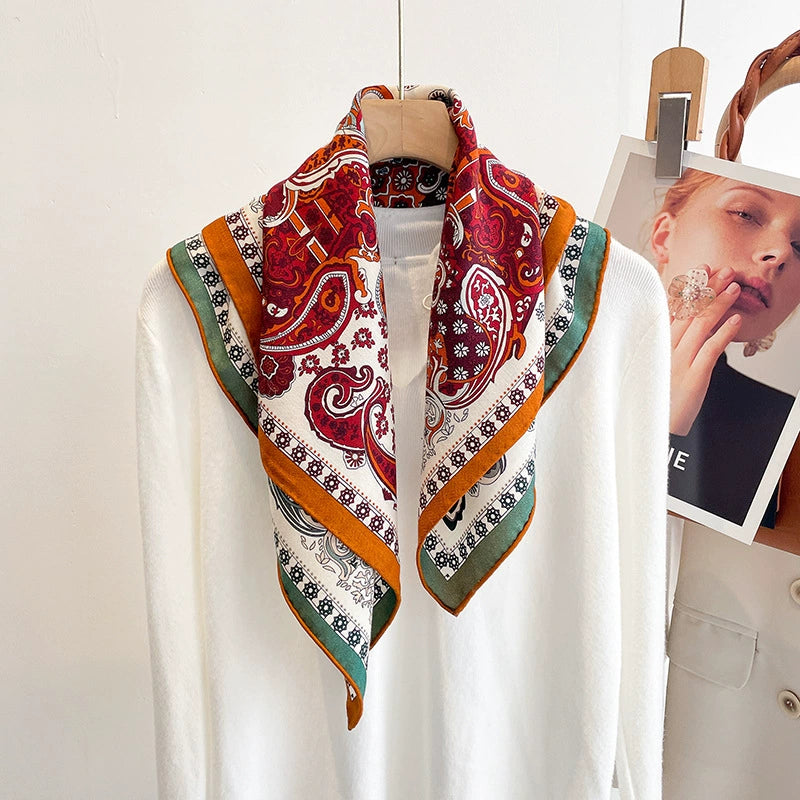 Elegant silk wool square scarf with double-sided paisley design styled with minimal outfit