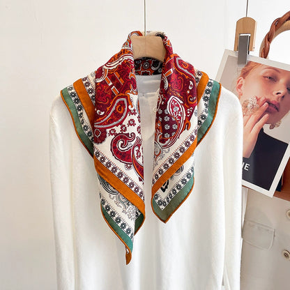 Elegant silk wool square scarf with double-sided paisley design styled with minimal outfit