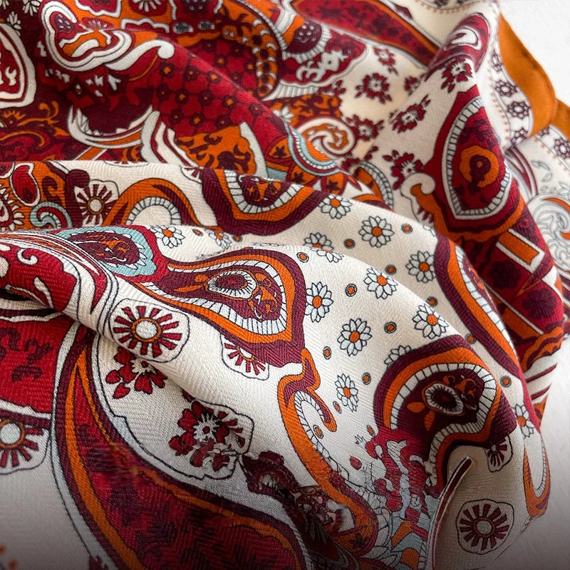 Silk wool scarf fabric texture detail showing soft drape and vintage paisley print pattern