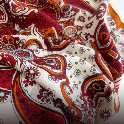 Silk wool scarf fabric texture detail showing soft drape and vintage paisley print pattern