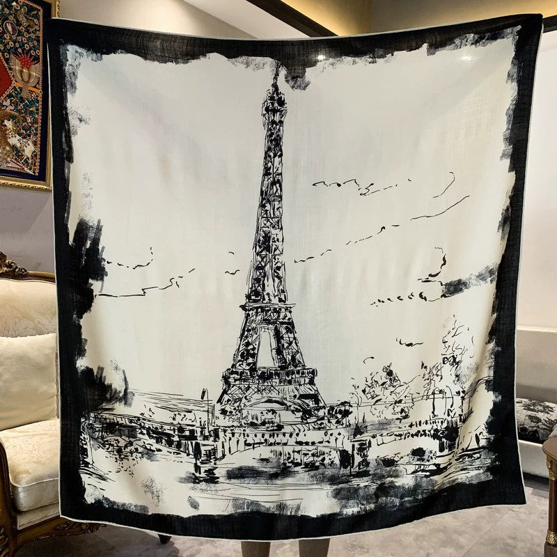 Black and ivory Eiffel Tower silk wool scarf displayed flat with a monochrome Paris sketch and dark border