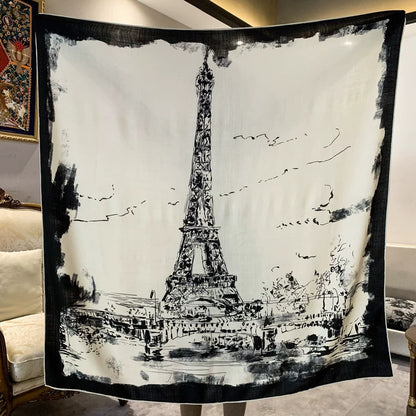 Black and ivory Eiffel Tower silk wool scarf displayed flat with a monochrome Paris sketch and dark border