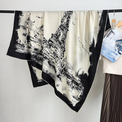 Large square silk wool scarf draped diagonally to show the black ink-wash Eiffel Tower and Paris street print