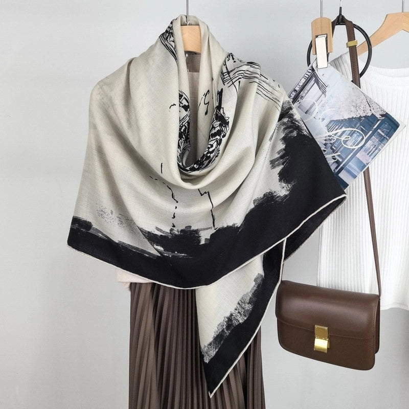 Oversized Eiffel Tower silk wool shawl wrapped around the shoulders in a soft black and ivory drape