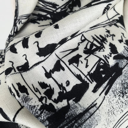 Close-up of monochrome Paris sketch and handwritten details on the Eiffel Tower silk wool scarf
