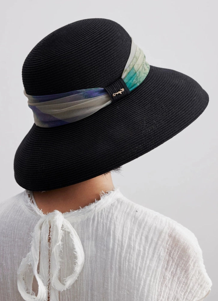 Back view of black scarf ribbon sun hat with dome crown and wide brim.