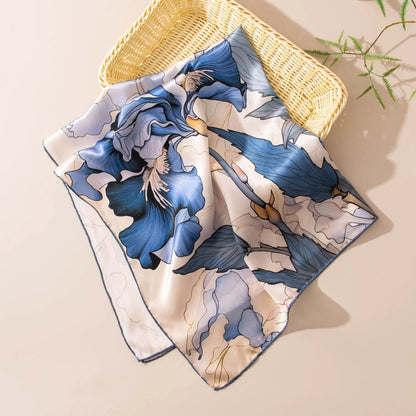 Luxury blue floral square silk scarf styled flat with artistic botanical details