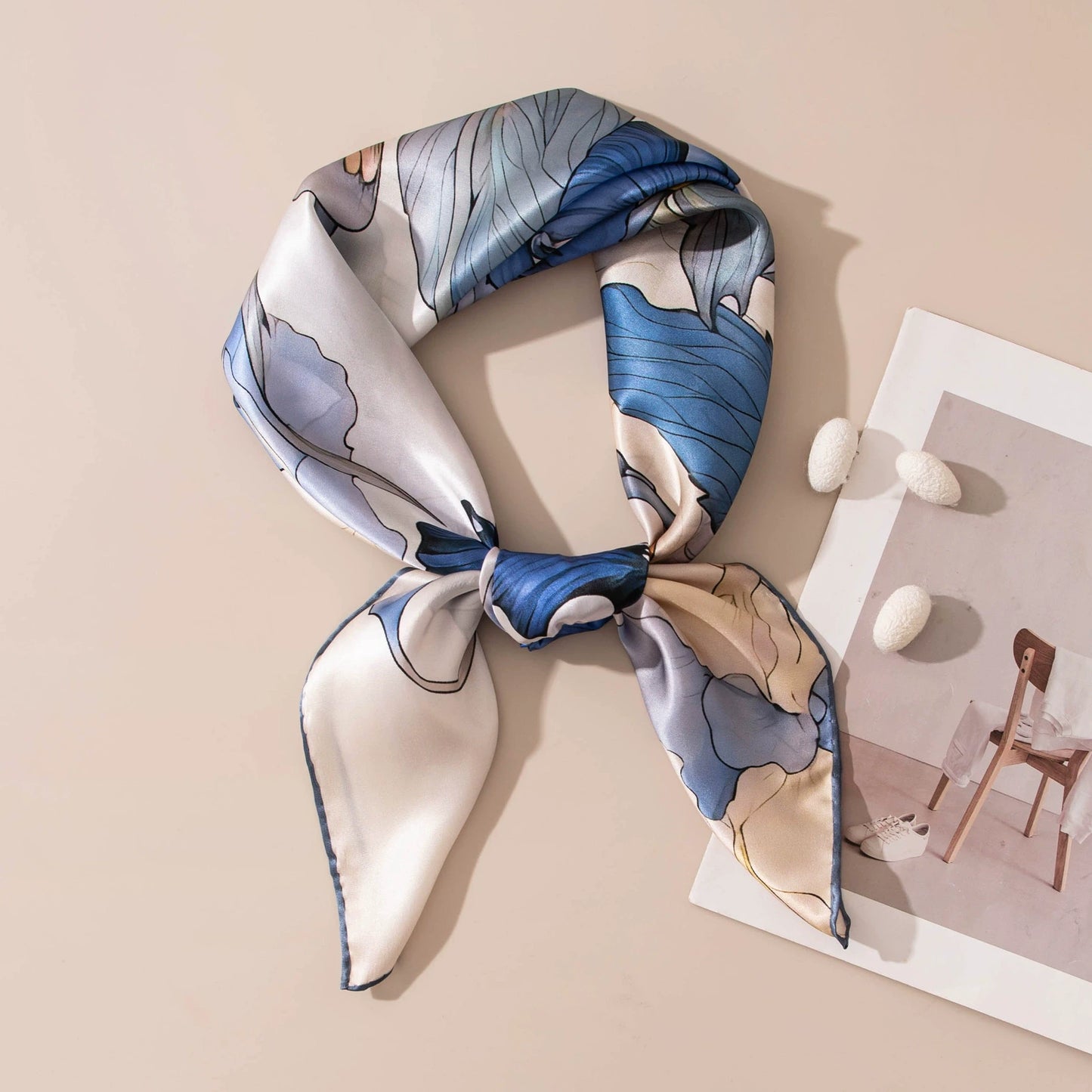 Romantic blue floral silk bandana scarf tied elegantly with soft botanical print details