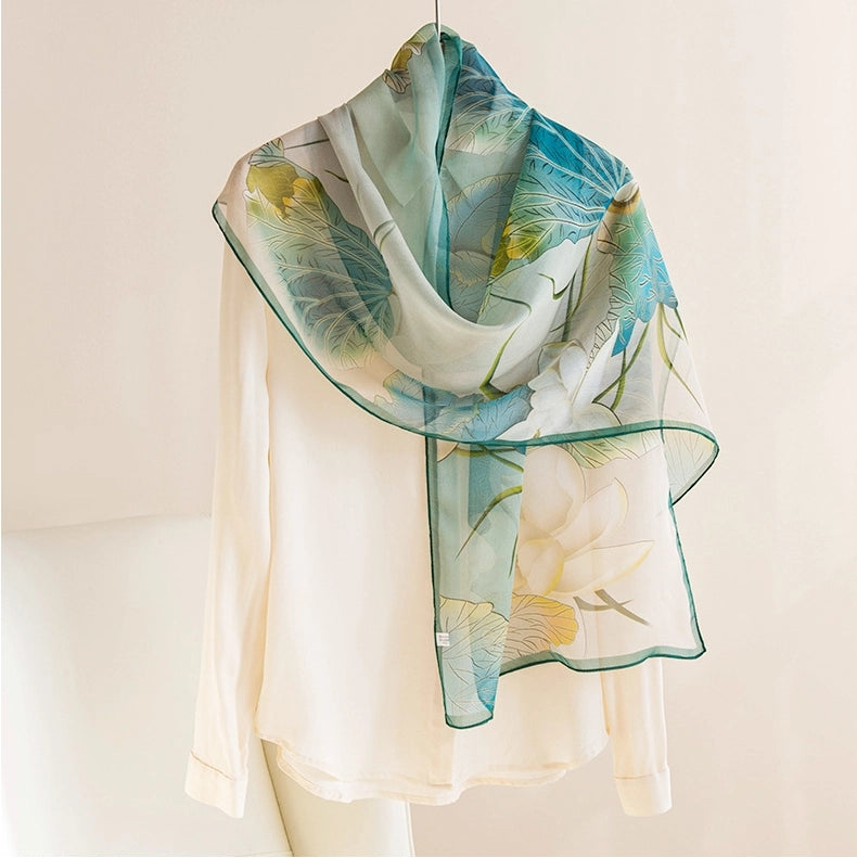 Lightweight lotus pattern mulberry silk scarf styled over a white blouse