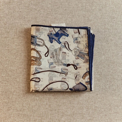 Folded silk wool square scarf with horse tack print, neutral tone vintage design