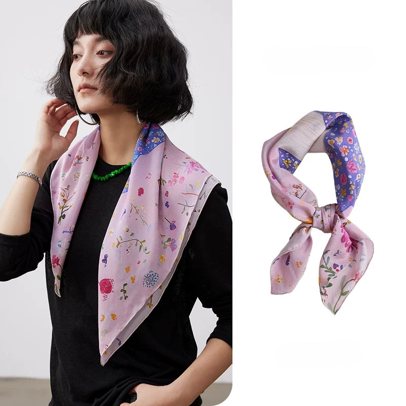 Pink floral dolphin mulberry silk square scarf styled on a model with an elegant neck drape.
