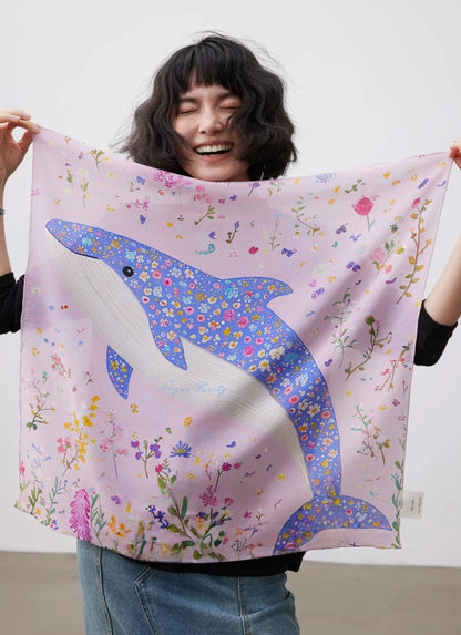100% mulberry silk square scarf in pink with dolphin and floral print shown in full view.
