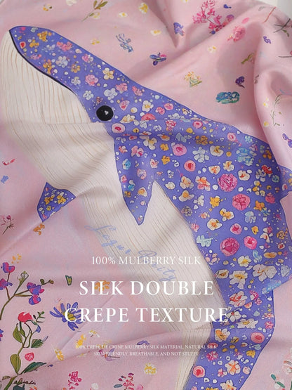 Close-up of pink floral dolphin silk scarf showing smooth double crepe texture.