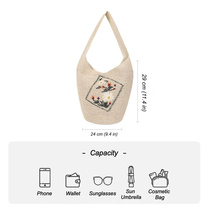 Floral embroidered straw shoulder bag showing capacity for phone wallet sunglasses sun umbrella and cosmetic bag