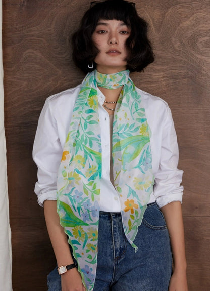 Botanical print skinny silk scarf in fresh green silk georgette styled with white shirt and denim
