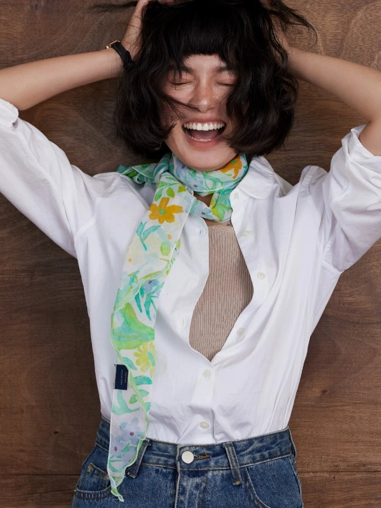 Fresh green silk georgette scarf worn as a slim neckerchief with soft floral botanical print