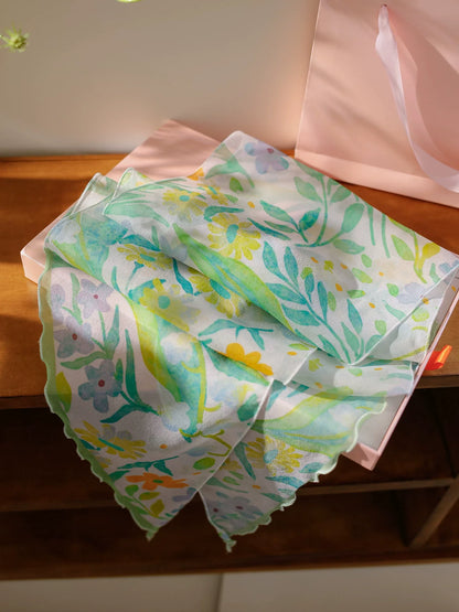 Fresh green botanical print silk georgette scarf detail showing soft floral pattern and sheer texture