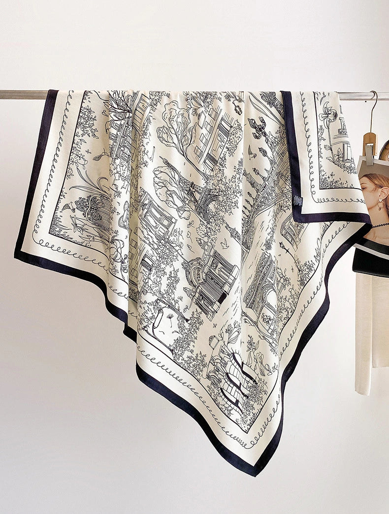 Ivory cityscape printed silk wool square scarf displayed open with a navy border