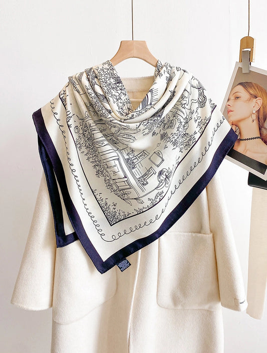 Ivory architectural print silk wool square scarf styled as a triangular shoulder wrap